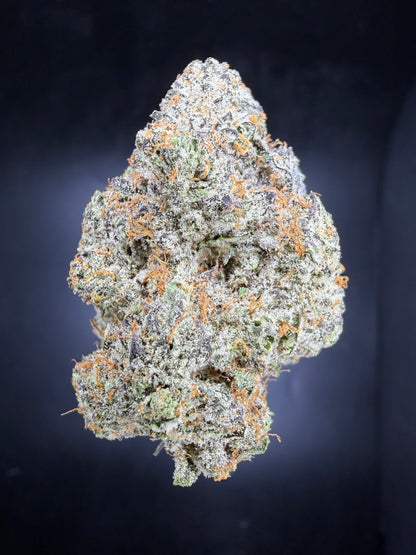 Blueberry Z premium indoor THCA hemp flower - dense purple-hued bud with heavy trichomes